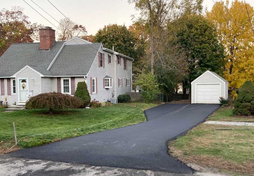 Freshly paved residential asphalt driveway in Cranston, RI