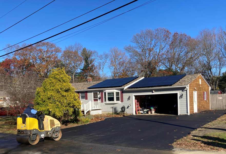 Newly finished residential asphalt driveway paving project in Cranston, RI