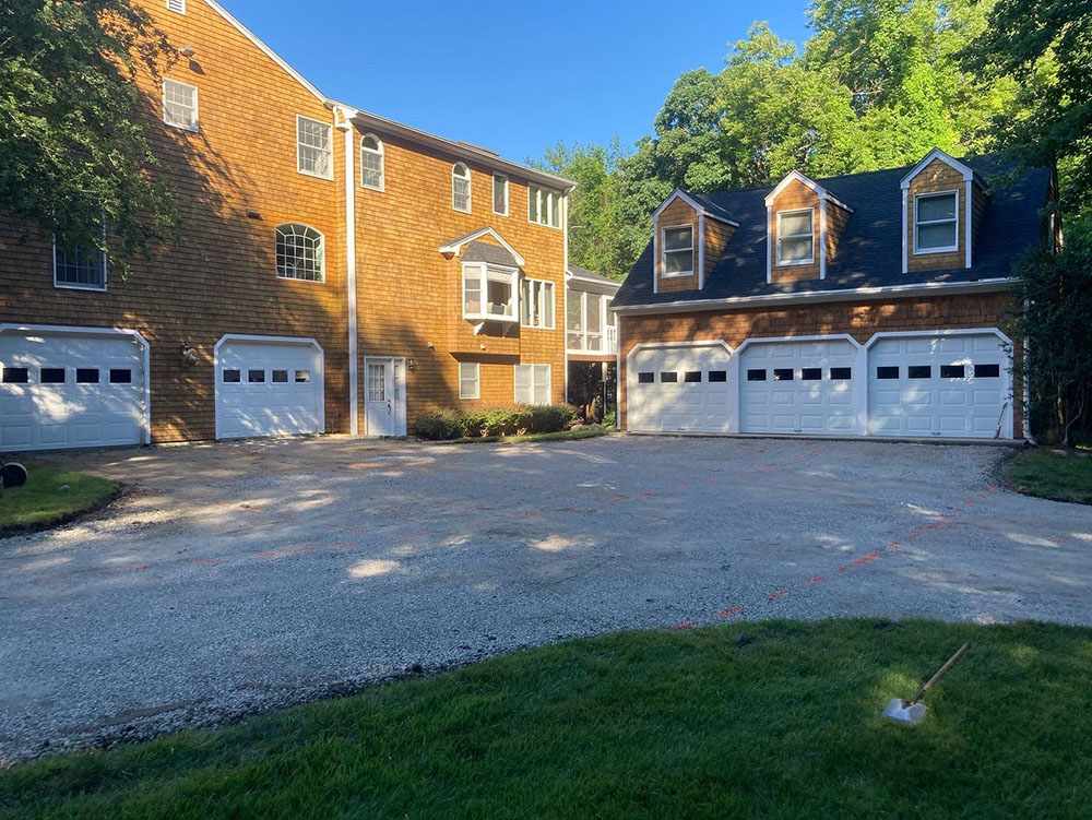 Residential asphalt driveway before repair in Cranston, RI